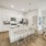 Beautiful bright kitchen with white cabinetry and stainless steel appliances 