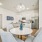 4 seater dining table with kitchen in background 