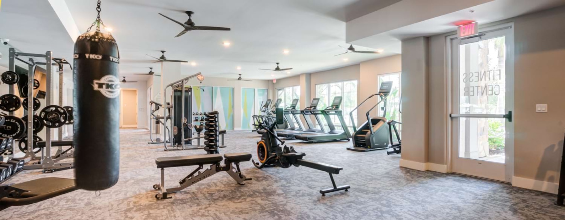 fitness center with weight training and cardio equipment