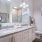 bathroom with two sinks and a large mirror